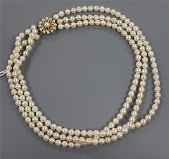 A three-row cultured pearl necklace fitted 9ct gold and pearl clasp, approx. 44cm.